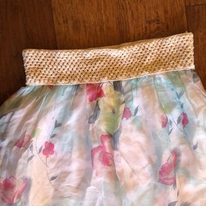 Floral pattern, flowy, floor length skirt. Woven elastic band at waist